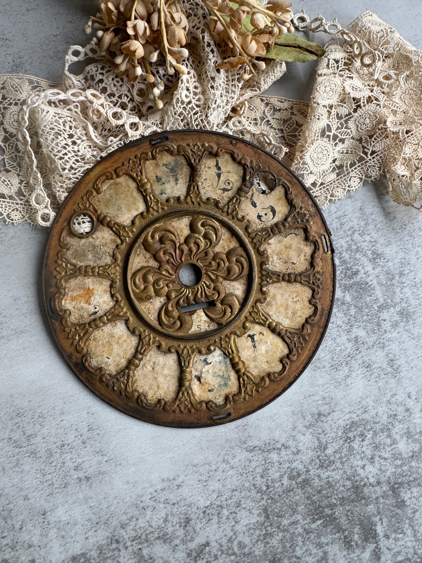 Antique Clock Face with Aged Patina and Elegant Details