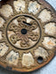 Antique Clock Face with Aged Patina and Elegant Details